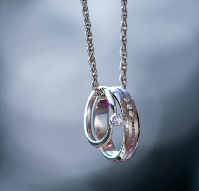 silver rings on necklace