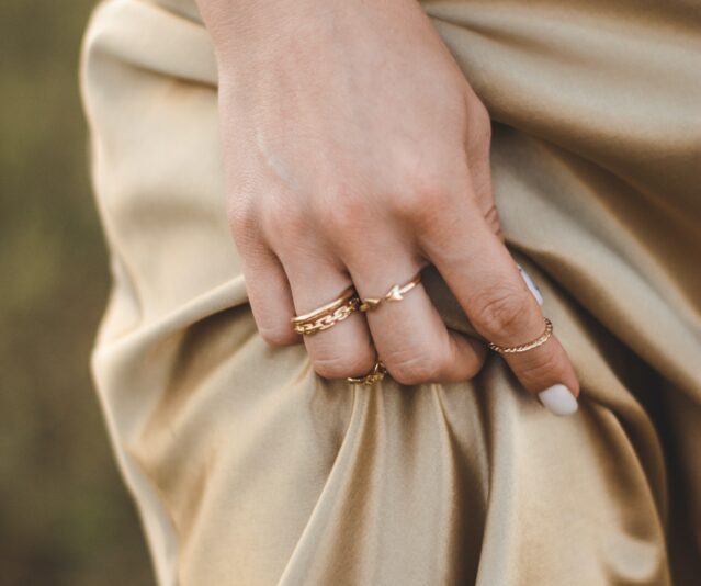 woman wearing gold rings