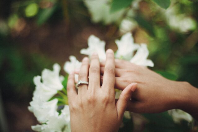 woman wearing diamond engagement ring