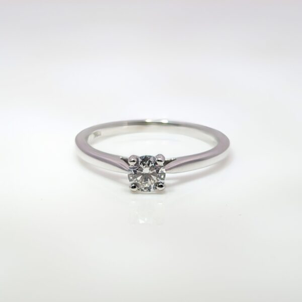 This timeless 18ct White Gold 0.30ct Round Brilliant Cut Diamond ring is a classic choice for engagements. GIA Certified. E Colour and S1 Clarity.