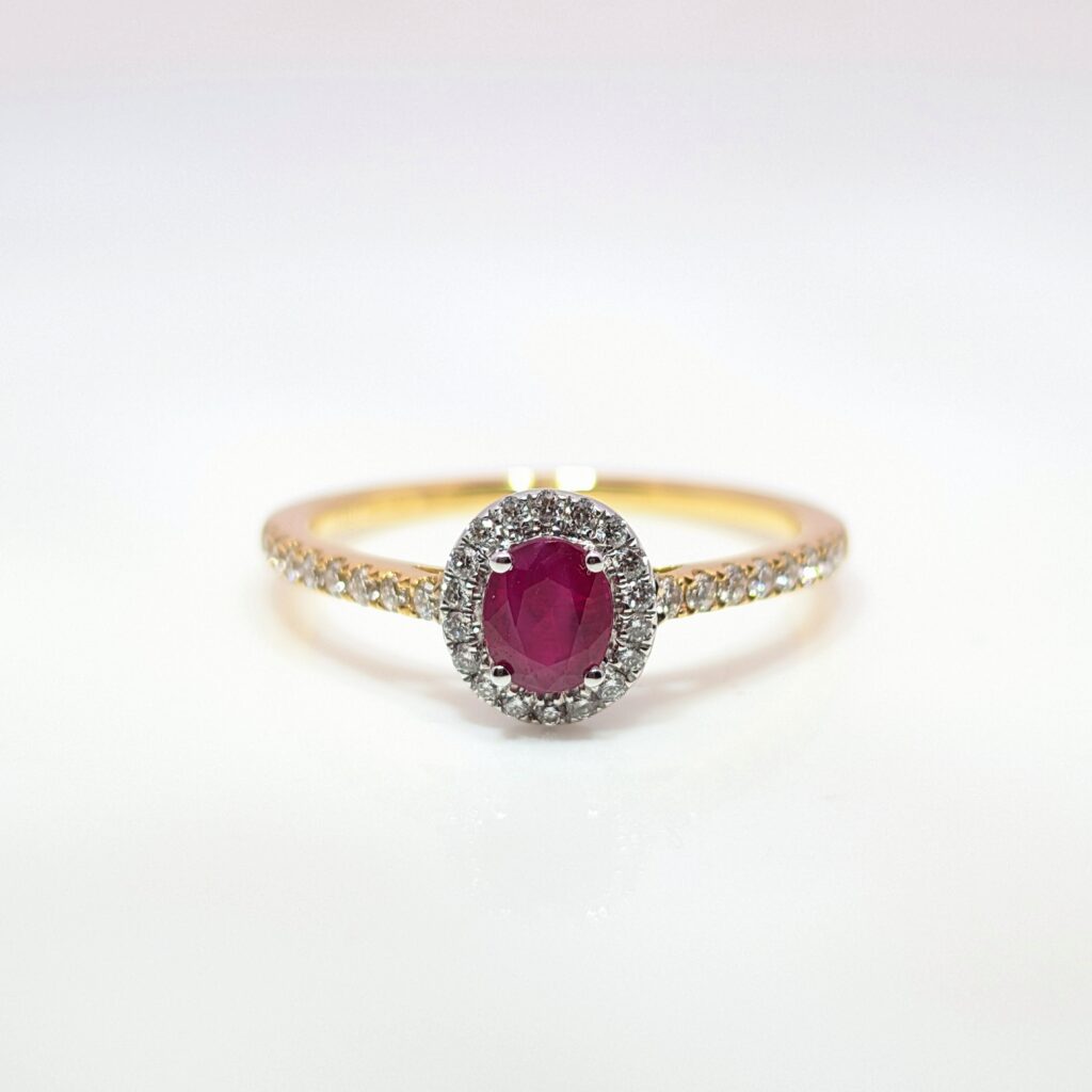ruby & diamond oval halo ring in 18ct yellow gold