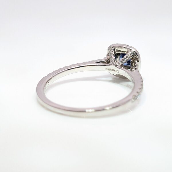 Our Pre-Loved Cushion Cut Sapphire and Diamond Halo Ring is set in a beautiful 14ct White Gold.