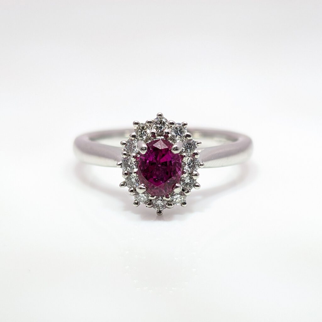 ruby & diamond oval halo ring in platinum