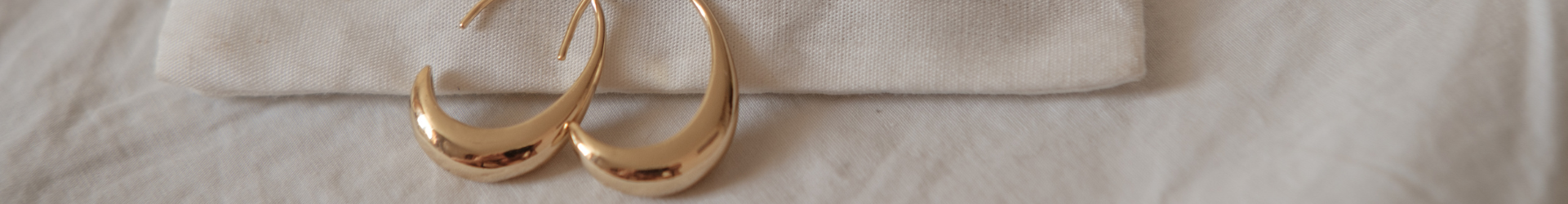close up of gold hoop earrings