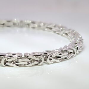Discover our Mens Heavy Sterling Silver Byzantine Bracelet that weighs 29.6 grams. Crafted from high-quality sterling silver, it features a classic Byzantine weave pattern, known for its intricate interlocking links that create a stunning, textured design.
