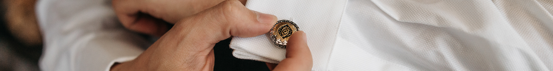 close up of gold cufflink