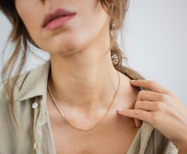 woman wearing simple gold chain