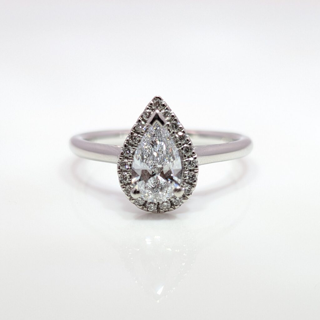 lab grown pear cut diamond halo engagement ring in platinum