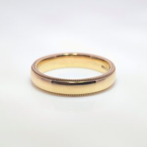 Discover our 4mm Beaded Edge Wedding Band in 9ct Yellow Gold. A balanced width that’s neither too narrow nor too wide, providing a versatile and classic appearance for both men and women.