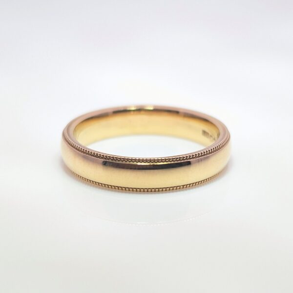 Discover our 4mm Beaded Edge Wedding Band in 9ct Yellow Gold. A balanced width that’s neither too narrow nor too wide, providing a versatile and classic appearance for both men and women.