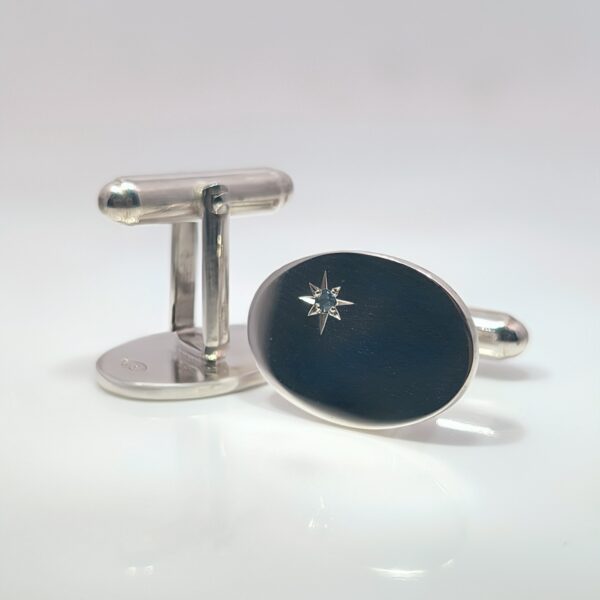 Discover our Sterling Silver Sapphire Oval Cufflinks. These silver cufflinks have a sapphire accent in a star design. The perfect addition for weddings or other formal occasions. Dimensions -19mm x 14mm