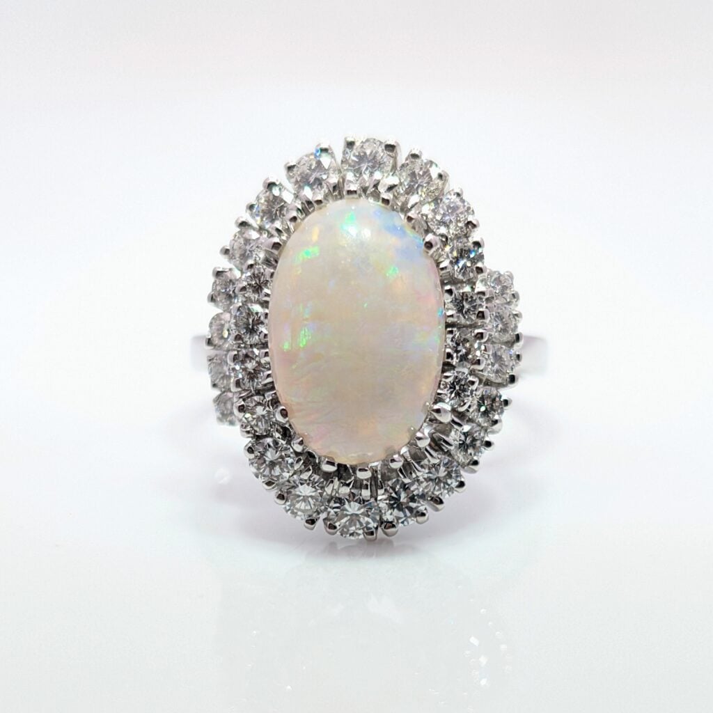 large opal & diamond swirl ring in 18ct white gold