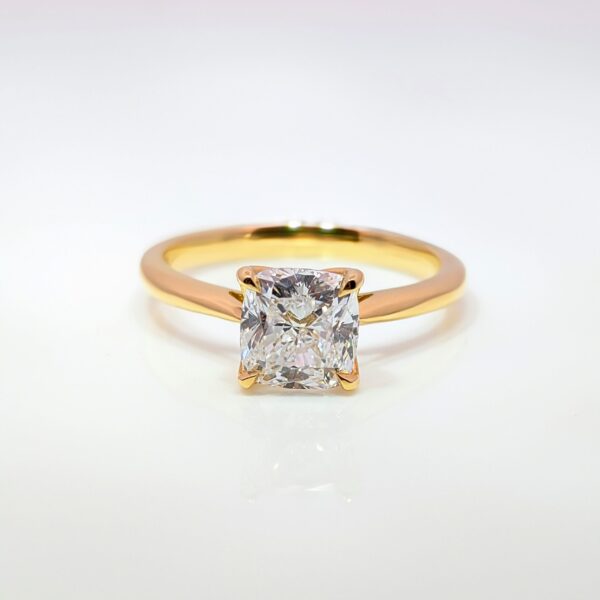 This exquisite gold ring features a stunning square-cut ‘cushion’ diamond that captures the light beautifully. Set in an 18ct yellow gold band with tallon claws it's an excellent choice for your engagement ring.