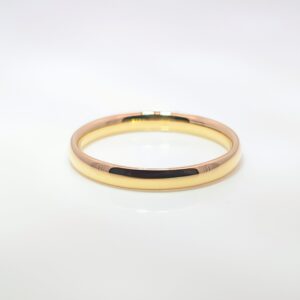 A wedding ring that has a rounded interior and a slightly domed exterior. It offers a soft, elegant profile with a comfortable fit, combining a traditional and timeless look with a smooth, curved design.