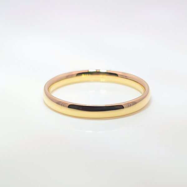 A wedding ring that has a rounded interior and a slightly domed exterior. It offers a soft, elegant profile with a comfortable fit, combining a traditional and timeless look with a smooth, curved design.