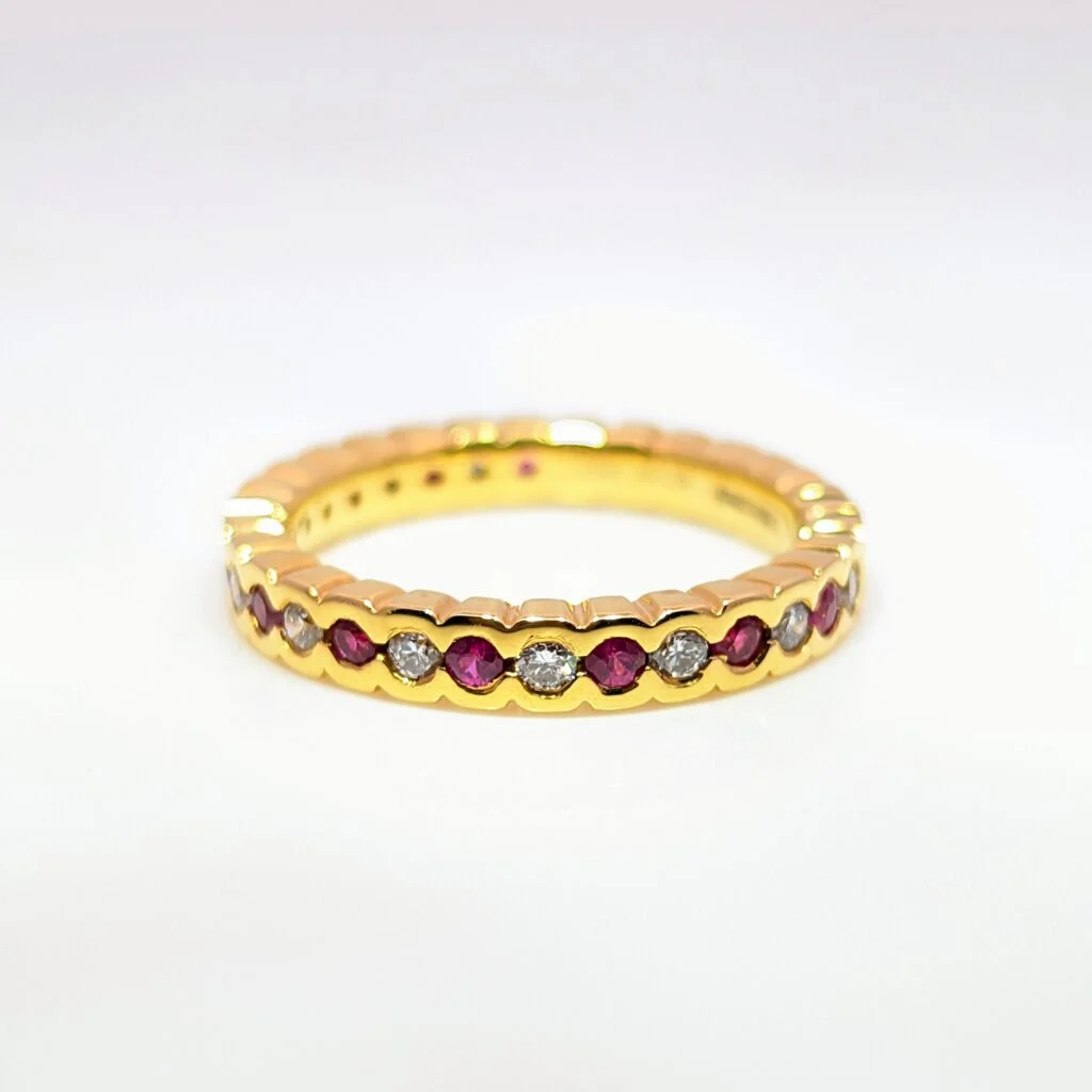 ruby & diamond half eternity ring in 18ct yellow gold