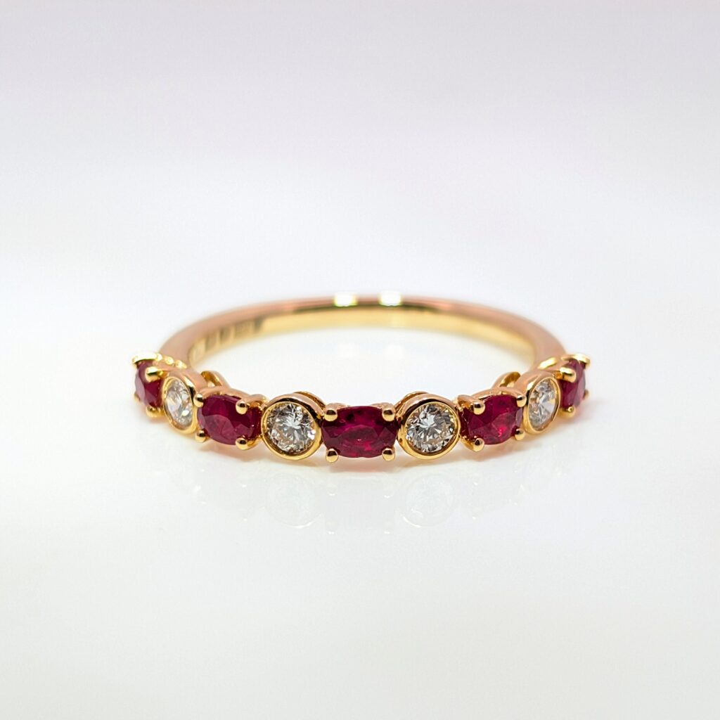mixed-cut diamond & ruby half eternity ring in 18k yellow gold