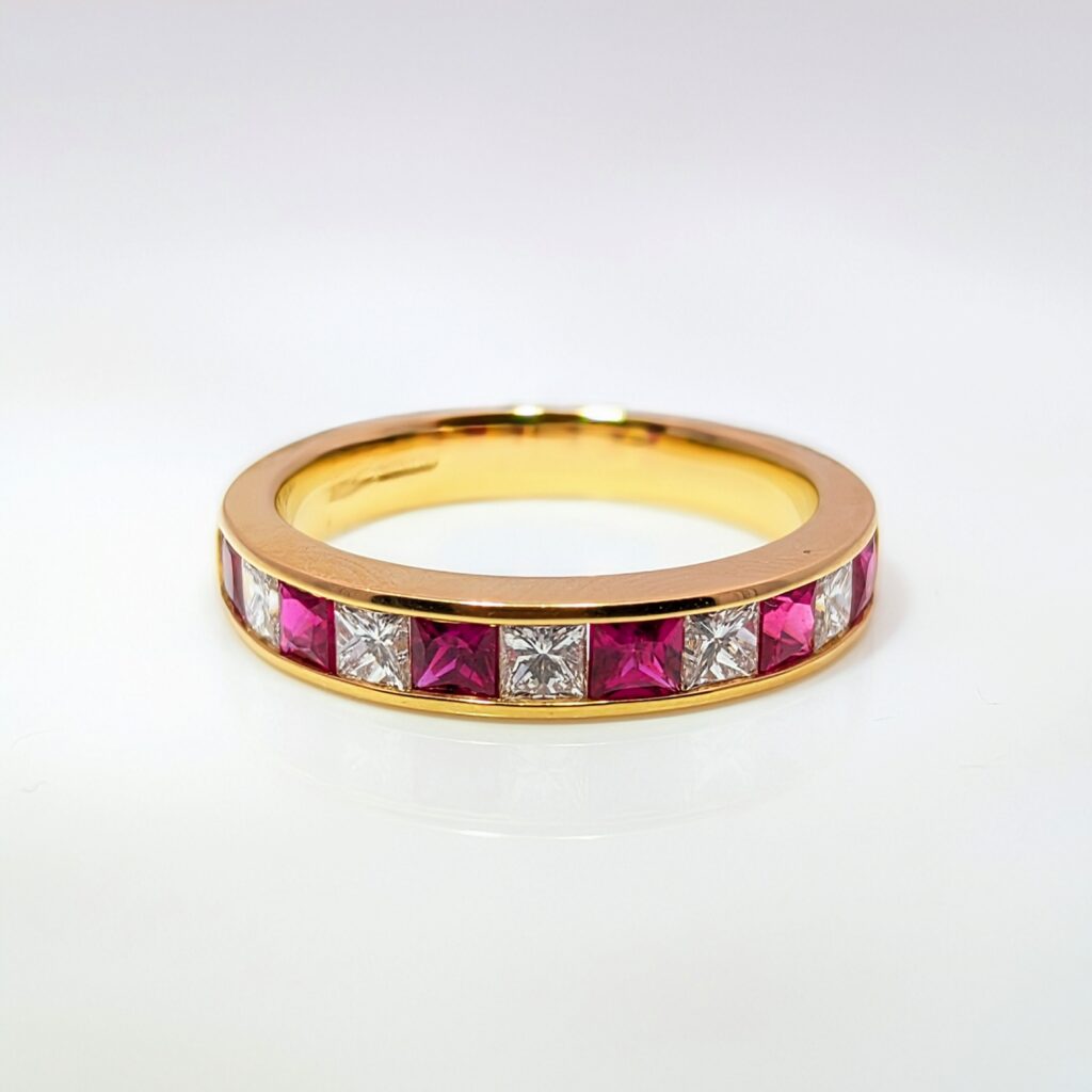 princess-cut ruby & diamond half eternity ring in 18k yellow gold