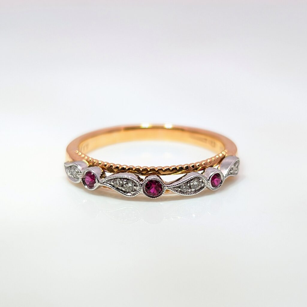ruby & diamond half eternity ring in 18ct rose & white gold