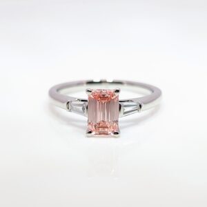 Discover our bespoke coloured lab grown diamond range. This pink diamond is set in a platinum mount with white diamond shoulders.