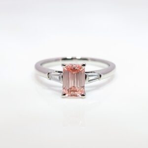 Discover our bespoke coloured lab grown diamond range. This pink diamond is set in a platinum mount with white diamond shoulders.