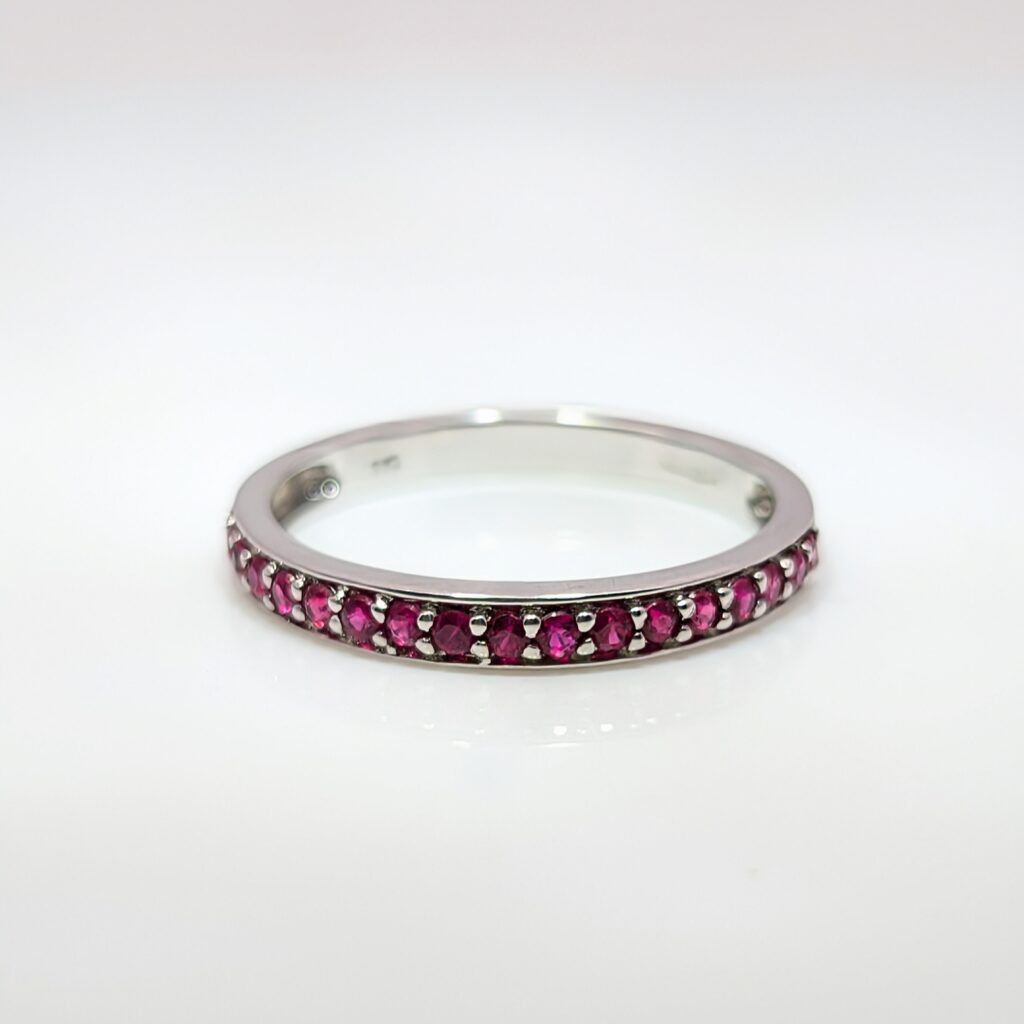 ruby half eternity ring in 9k white gold