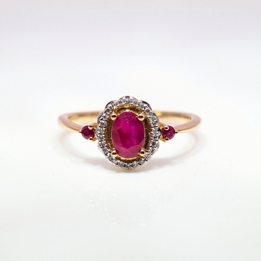 0.64ct Oval Ruby and 0.07ct Diamond Halo Ring 9ct Yellow Gold | 33988