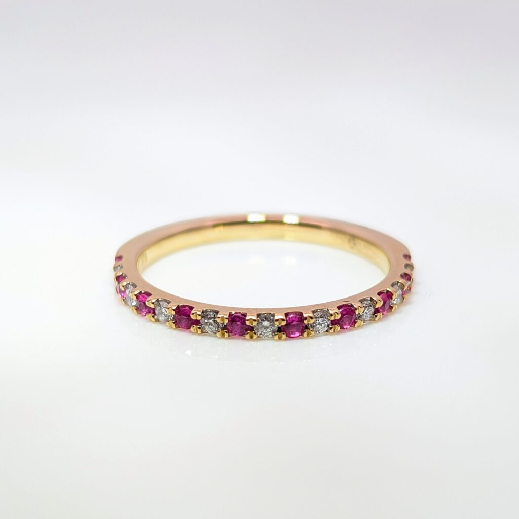 claw-set ruby & diamond half eternity ring in 9k yellow gold