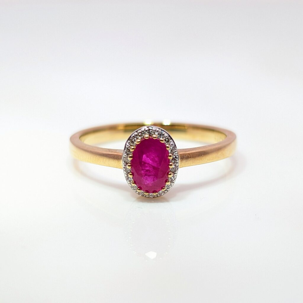 0.57ct Oval Ruby Ring with 0.06ct Diamond Halo 9k Yellow Gold | 37816