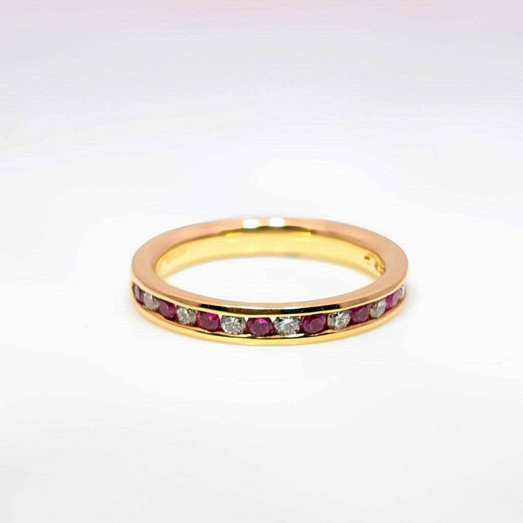 ruby & diamond half eternity ring in 18k yellow gold