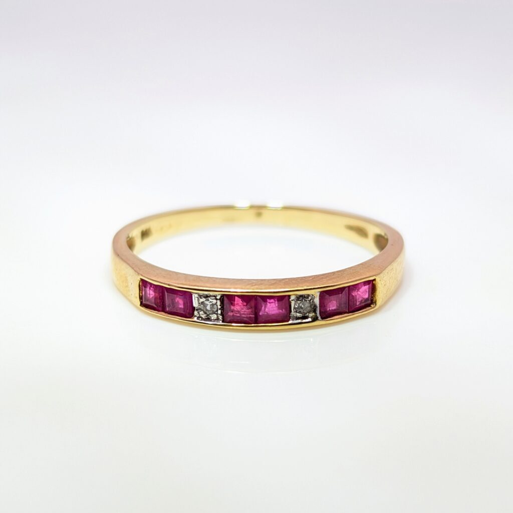 channel-set square ruby & diamond half eternity ring in 9k yellow gold