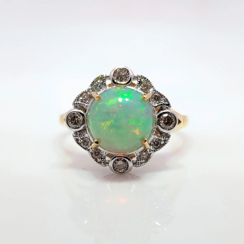 opal & diamond halo ring in 18ct yellow gold