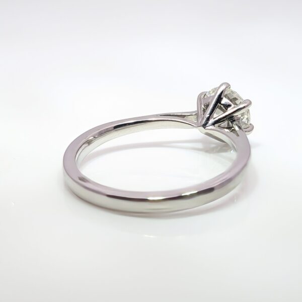 Expertly crafted in platinum, this engagement ring features a round 1.00ct solitaire diamond nestled within a classic six-claw setting. A traditional design that will surely captivate the heart of your beloved.