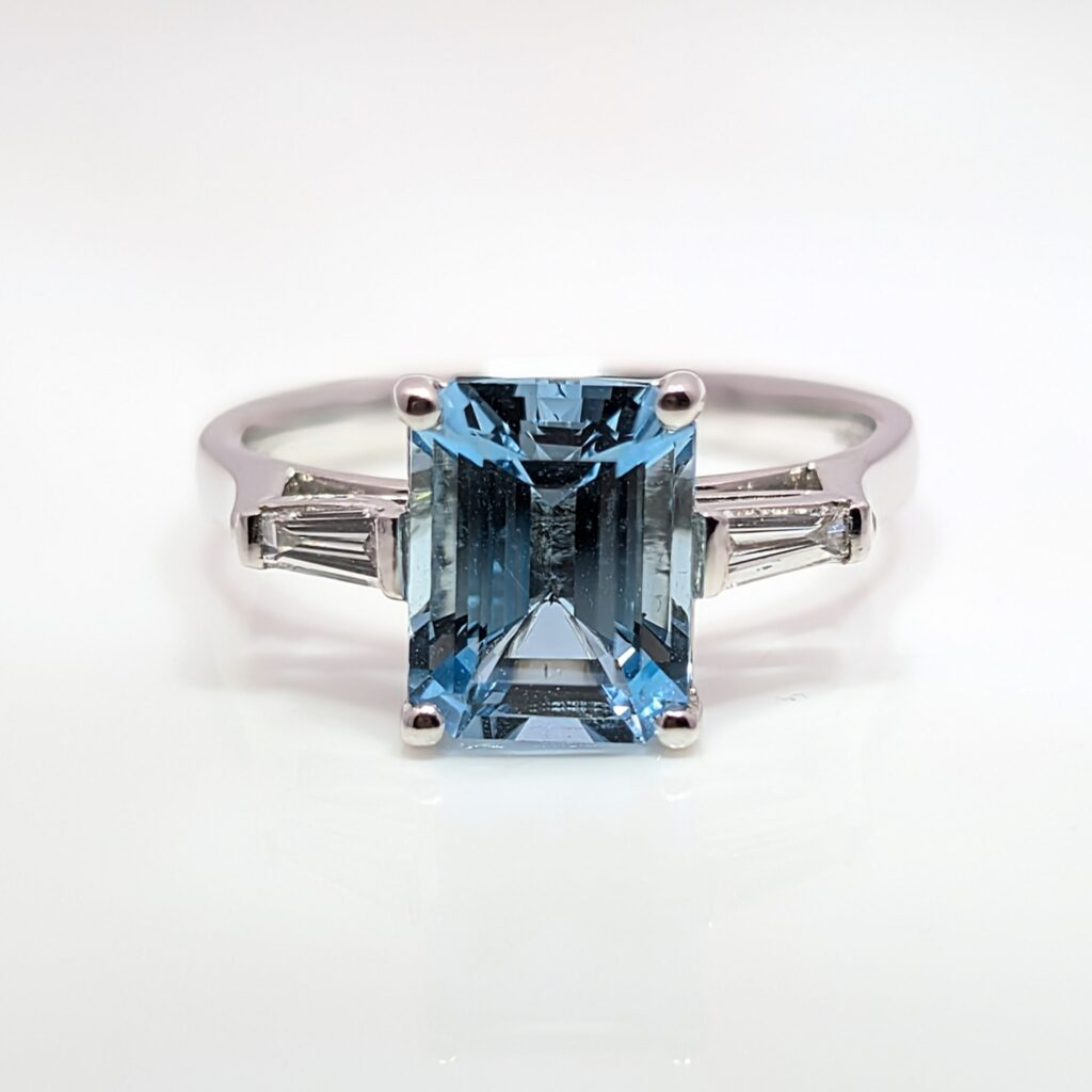 aquamarine ring with diamond baguette shoulders in 18ct white gold