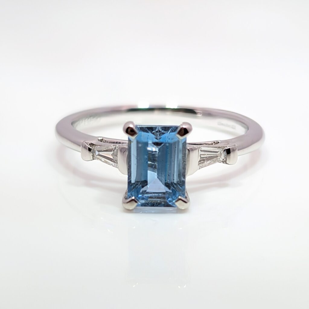 aquamarine ring with diamond baguette shoulders in platinum