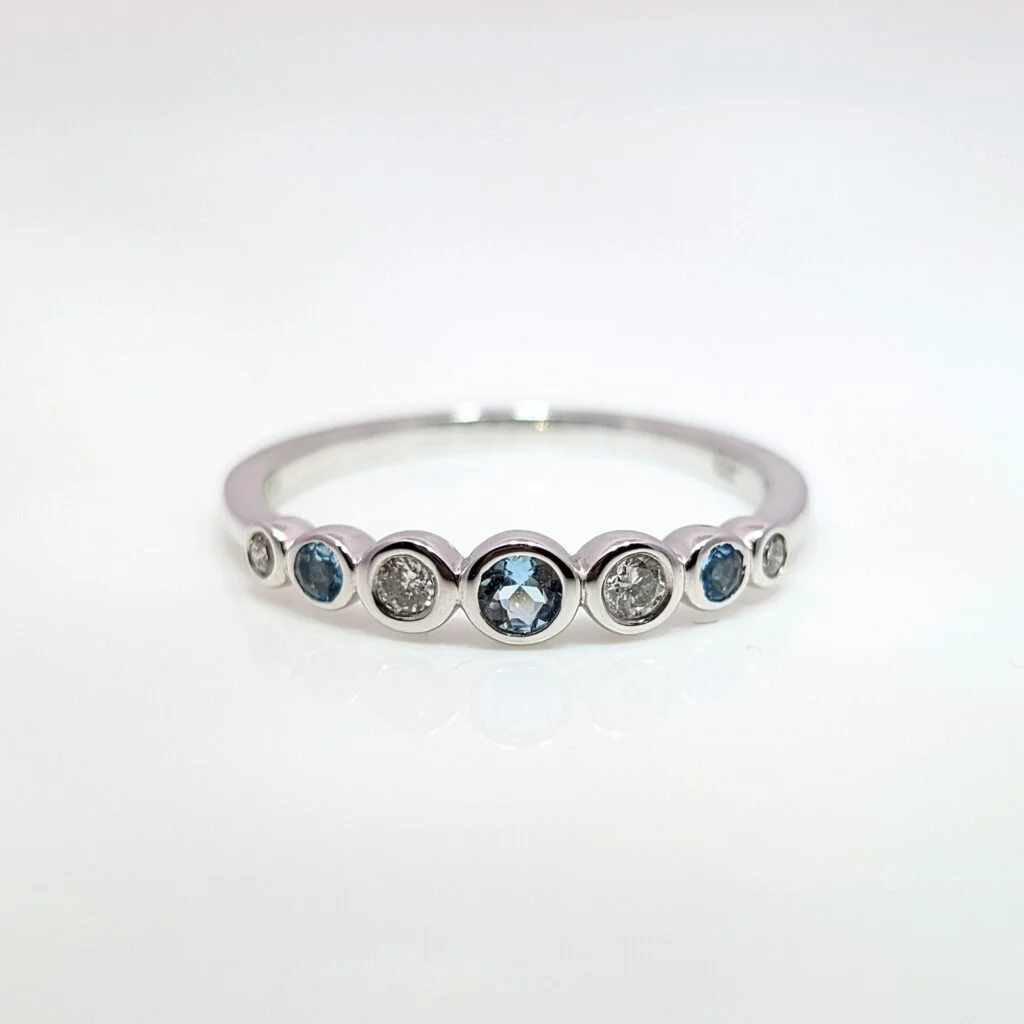 graduated aquamarine & diamond half eternity ring in 9k white gold