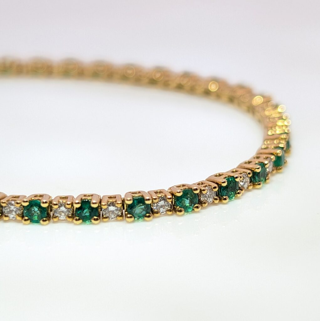 Discover our Emerald and Diamond Tennis Bracelet in 18ct Yellow Gold. This classic piece has 1.94ct of Emeralds and 0.83ct of Diamonds. Emerald jewellery is a timeless gift, but is especially meaningful to those with a May birthday.