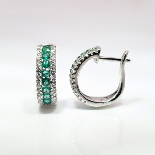 Discover our 0.40ct Emerald and Diamond Huggie Earrings in 18ct White Gold . Emerald jewellery is a timeless gift, but is especially meaningful to those with a May birthday.