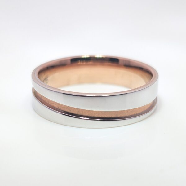 Discover our 6mm Mens Wedding Band in 9ct Rose Gold and White Gold. A slightly wider band offering more presence on the finger without feeling too bulky. Perfect for those who want a bolder, yet comfortable option.