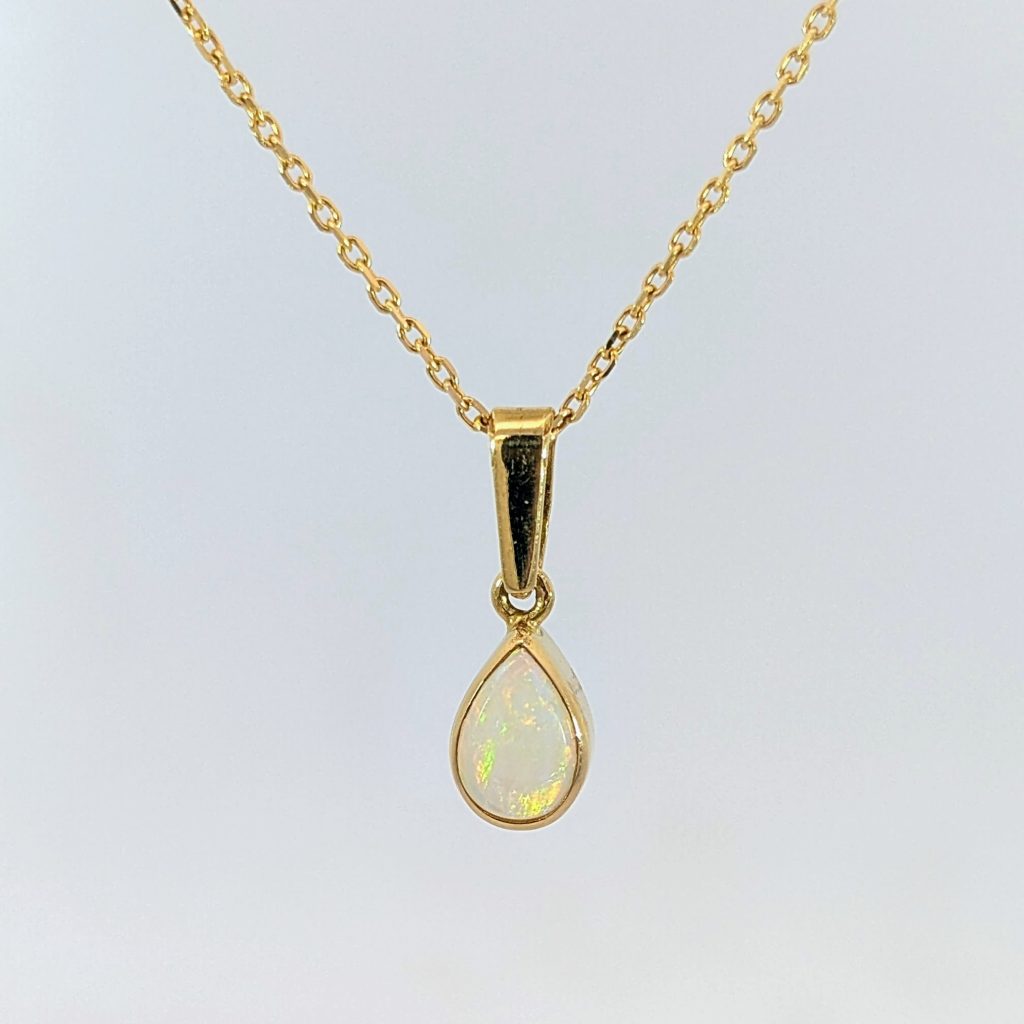 Vintage pre-loved pear shaped opal pendant in 18k yellow gold
