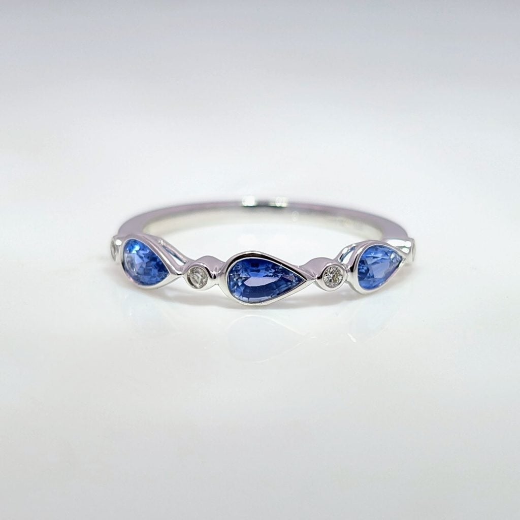 pear sapphire & diamond half eternity ring in 9ct white gold