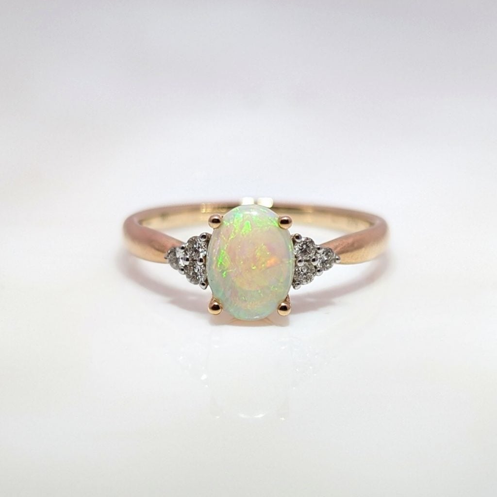 oval opal & diamond ring in 9ct yellow gold