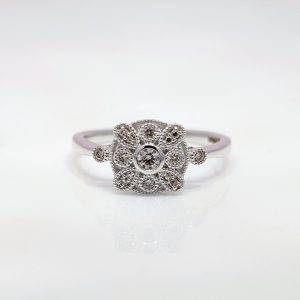 over our 0.15ct Diamond Art Deco Style Ring in 9k White Gold. Each diamond is beautiful set in a blend of bezel and claw setting and further decorated with beading.