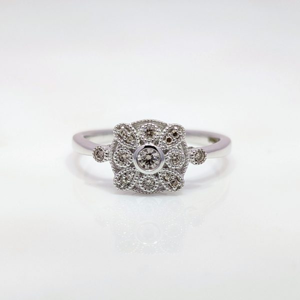 over our 0.15ct Diamond Art Deco Style Ring in 9k White Gold. Each diamond is beautiful set in a blend of bezel and claw setting and further decorated with beading.