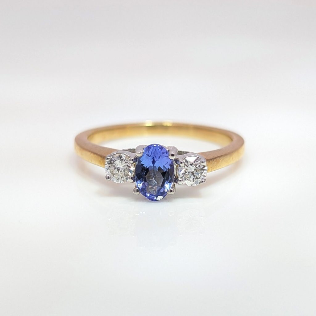 oval tanzanite & diamond trilogy ring in 9ct white gold