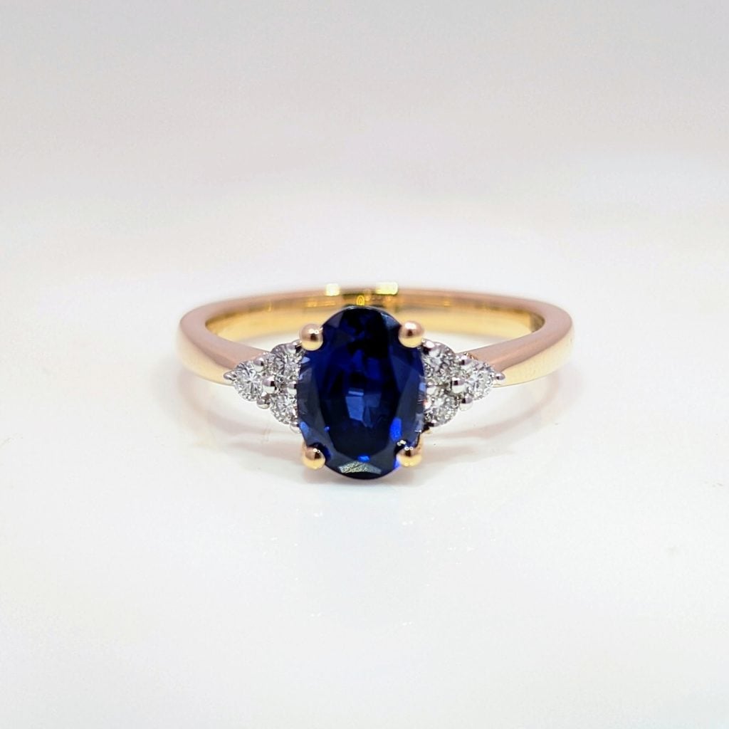 lab grown oval blue sapphire & diamond engagement ring in 9k yellow gold