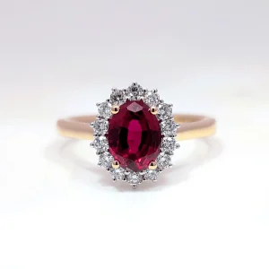 image of a ring with red and white diamond stones on a yellow gold band