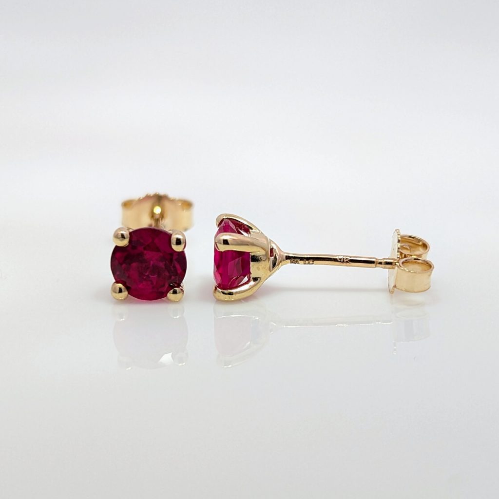Round lab grown ruby stud earrings in 9k yellow gold