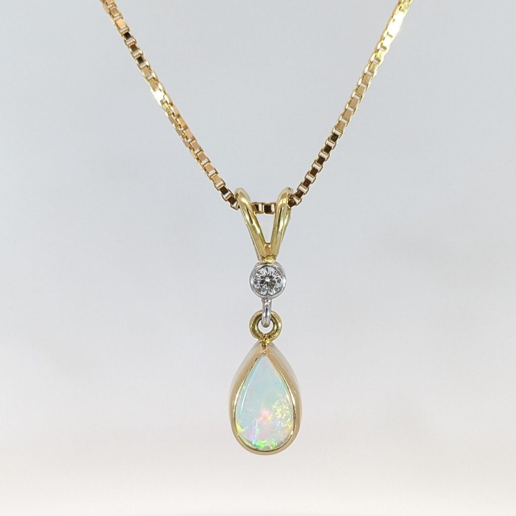 Vintage pre-loved opal and diamond drop pendant in 18k yellow gold