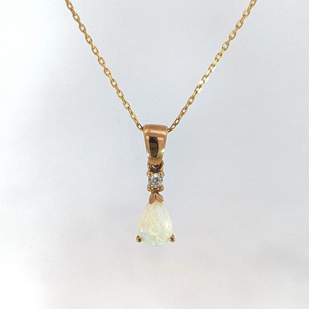 pear-shaped opal & diamond drop pendant in 9ct yellow gold